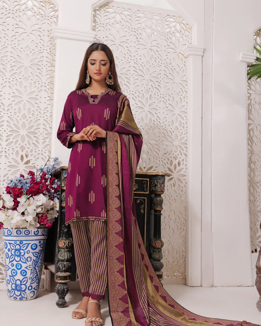 Woman in a purple traditional outfit with a matching dupatta in a decorative setting.